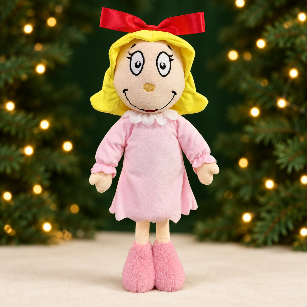 Cindy Lou Who Plush with a green and gold Christmas background
