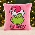 Pink Grinch Cushion with a green and gold Christmas background