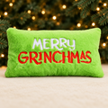 Long Merry Grinchmas Cushion with evergreen branches and golden Christmas lights